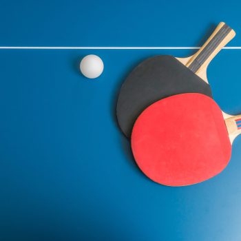 Ping pong or table tennis background with rackets